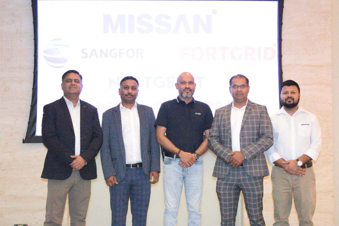 Group photo in front of a screen showing the Missan, Sangfor and FortGrid logos at NextGen IT Innovation 2024